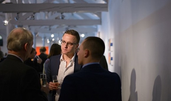 A  student networking with professionals at Dovecot Studio Edinburgh