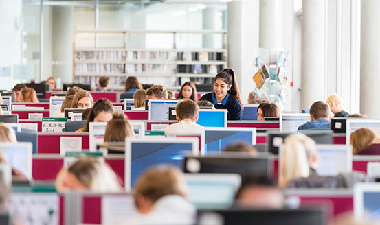 Rows of  University students working on desktop computers
