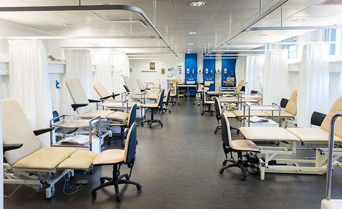 A specialist podiatry lab at  University, with beds, chairs and sinks