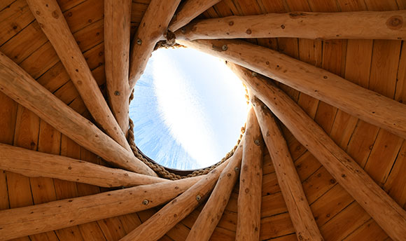 Wooden roof of the Howff at , with a glimpse of blue sky above